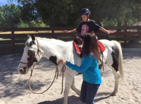 andy-learning-to-ride-on-his-soon-to-be-adopted-horse-maverick.jpg