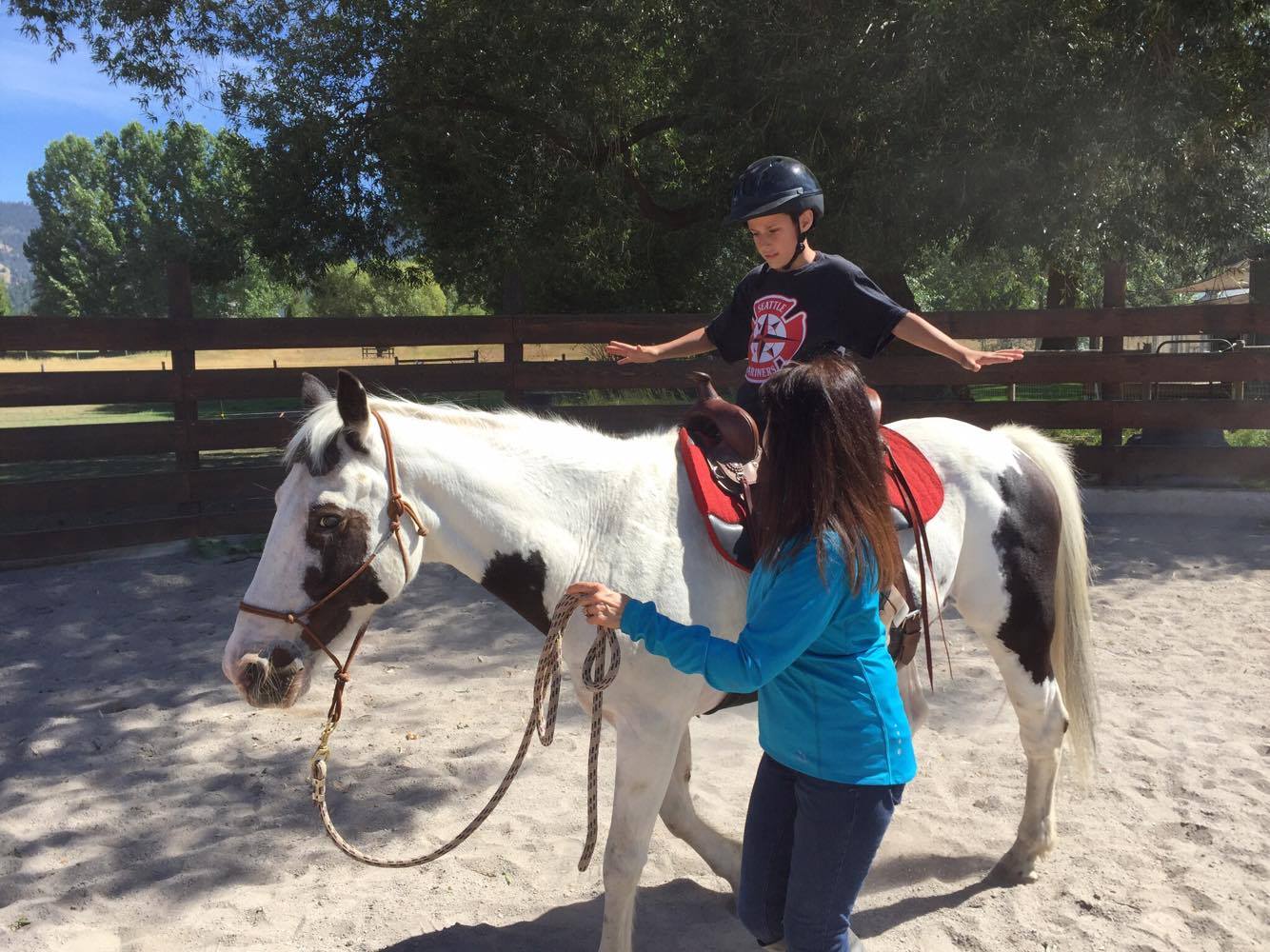 Andy, learning to ride on his soon to be adopted horse Maverick